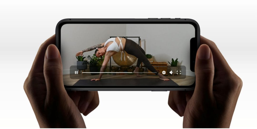 Cell phone in landscape with My Vinyasa Practice App Featured